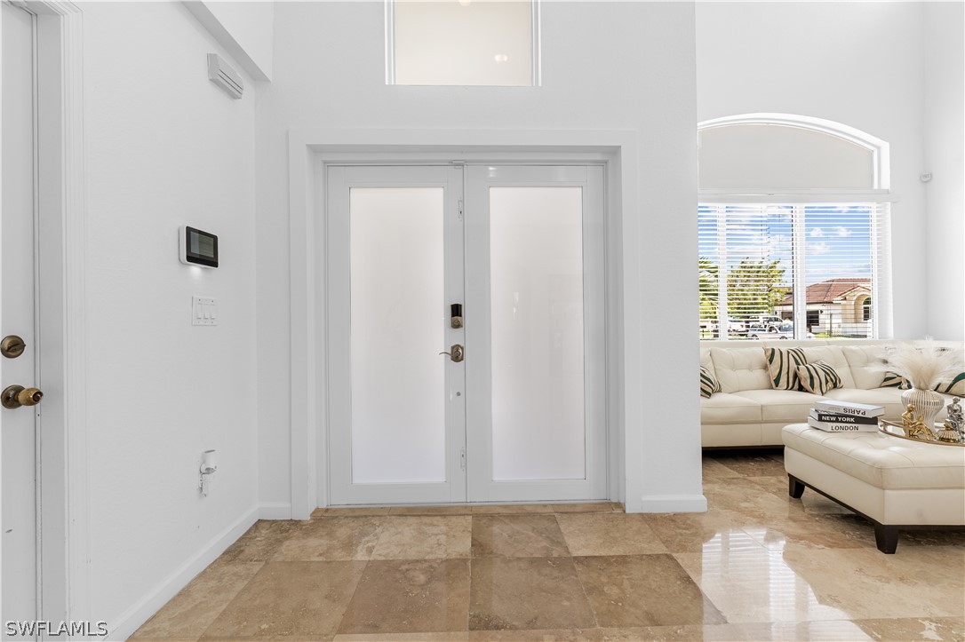 13302 Southwest 283rd Street Homestead, FL 33033 - Photo 4 of 43 a living room with furniture and a window