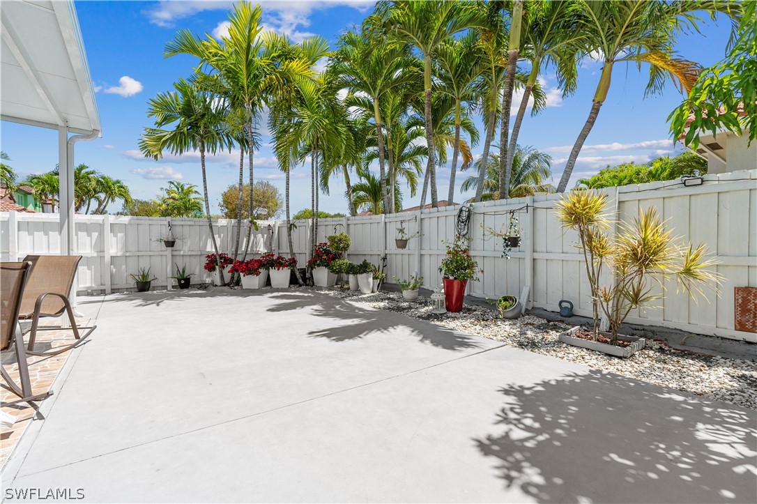 13302 Southwest 283rd Street Homestead, FL 33033 - Photo 41 of 43 a view of backyard with a table and chair