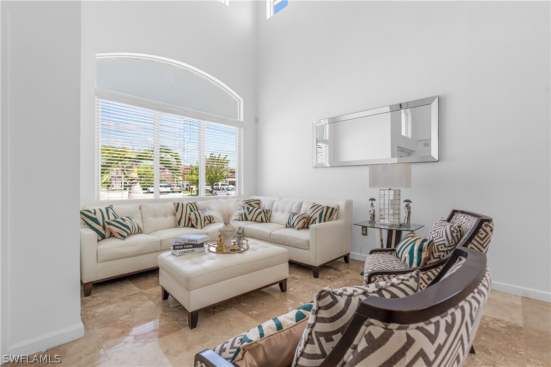 13302 Southwest 283rd Street Homestead, FL 33033 - Photo 5 of 43 a living room with furniture and a large window