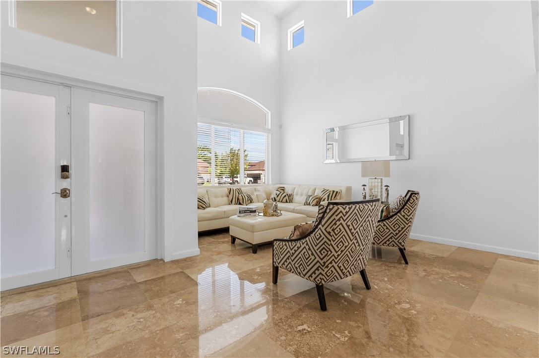13302 Southwest 283rd Street Homestead, FL 33033 - Photo 10 of 43 a living room with furniture and a window