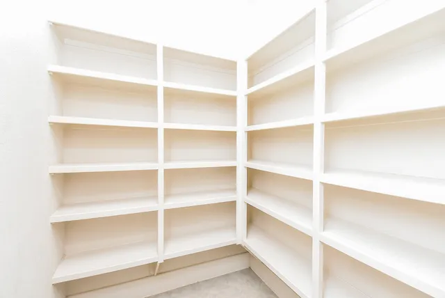a kitchen with granite countertop stove sink and cabinets