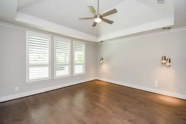 a white toilet sitting next to a shower