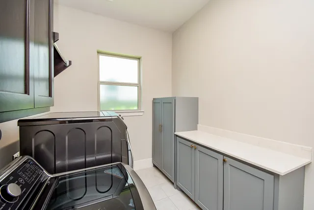 a bathroom with a shower and a sink