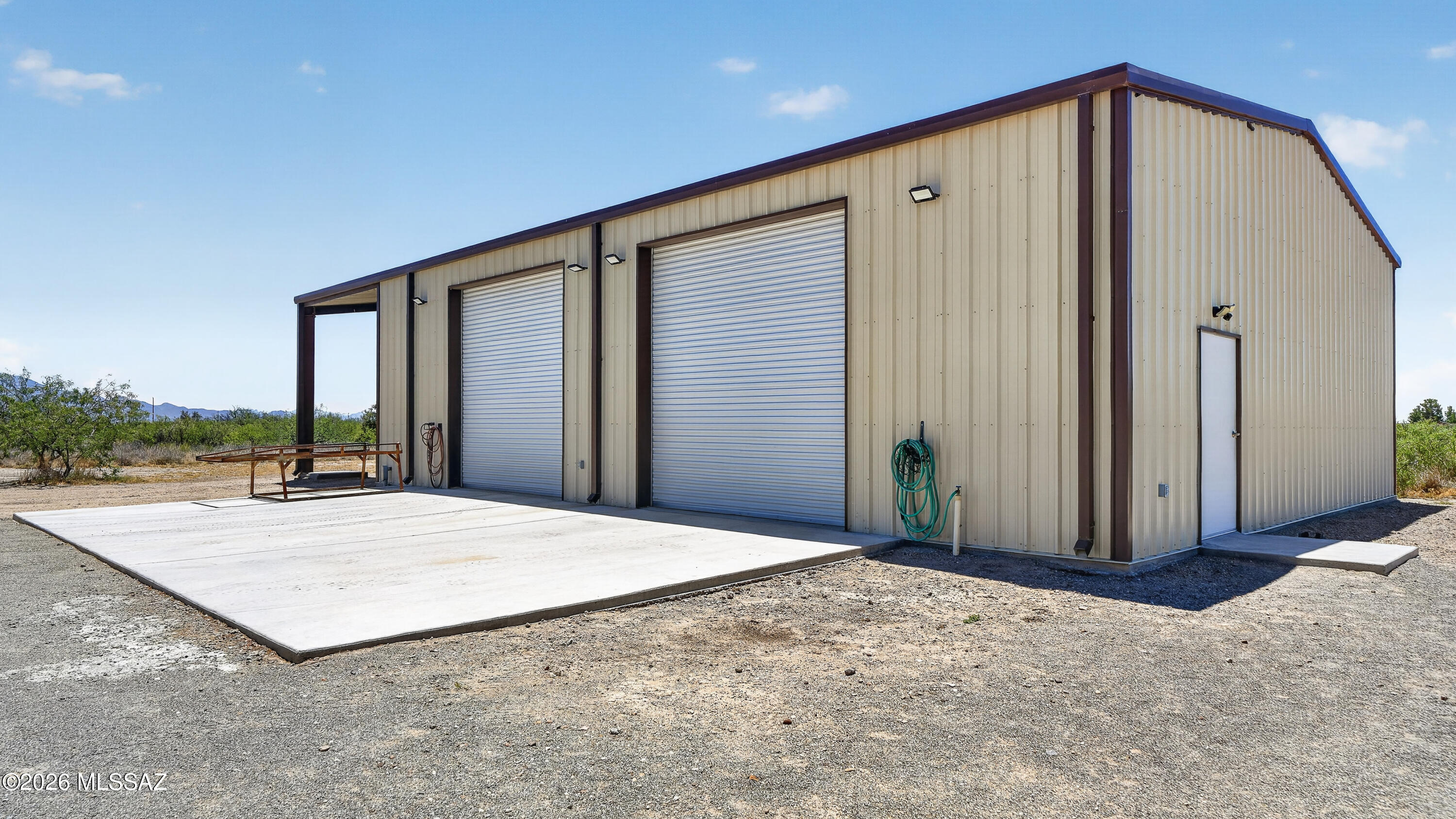 194 Taylor Road Willcox, AZ 85643 - Photo 38 of 54 50x40 (16' tall at peak) Insulated Metal Building with 14'6 x40 (14' tall opening) RV Covered parking, 6" Concrete Slab, 50amp Plug, 110 plug, water spicket, 5 exterior LED lights, 1 LED Motion LED Light at 48" steel entry door, 1000 gallon Septic tank in rear, 39x20 Concrete Apron, Plumbed on demand Air
