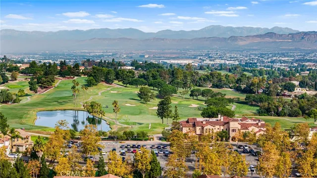 a view of a lush green hillside and houses