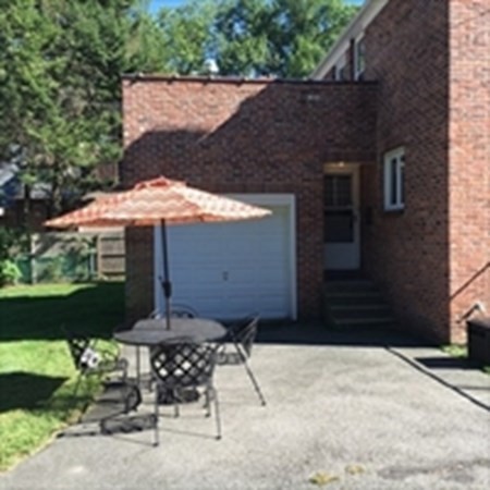 175 Brittany Road Springfield, MA 01151 - Photo 15 of 16 a front view of a house with a yard