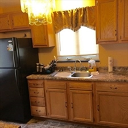 175 Brittany Road Springfield, MA 01151 - Photo 4 of 16 a kitchen with appliances cabinets and a sink