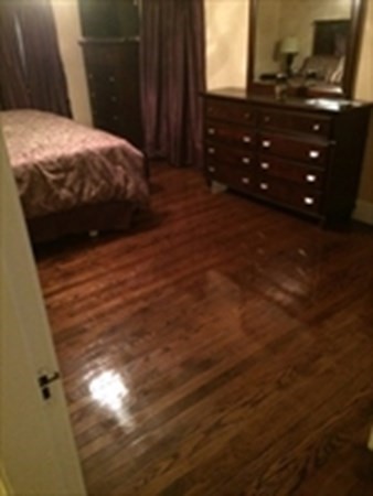 175 Brittany Road Springfield, MA 01151 - Photo 8 of 16 a bedroom with a bed and a flat tv screen