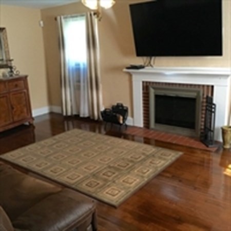 175 Brittany Road Springfield, MA 01151 - Photo 10 of 16 a living room with a fireplace