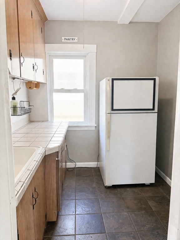 97 Plimpton Street Southbridge, MA 01550 - Photo 11 of 19 a utility room with cabinets washer and dryer
