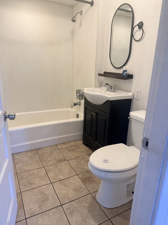 97 Plimpton Street Southbridge, MA 01550 - Photo 18 of 19 a bathroom with a sink a toilet and a mirror