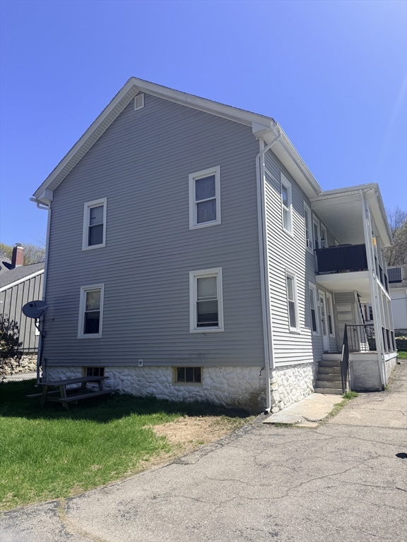 97 Plimpton Street Southbridge, MA 01550 - Photo 5 of 19 a house that has a big yard in front of it