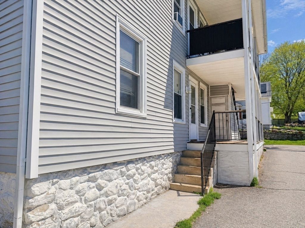 97 Plimpton Street Southbridge, MA 01550 - Photo 6 of 19 a view of a house with a door and wooden walls