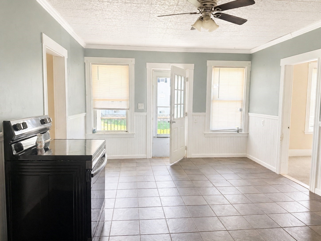 97 Plimpton Street Southbridge, MA 01550 - Photo 9 of 19 a view of a room with a window and a ceiling fan