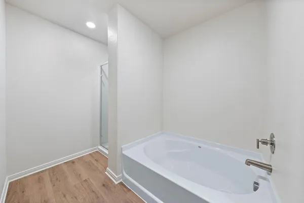 a bathroom with a tub and sink