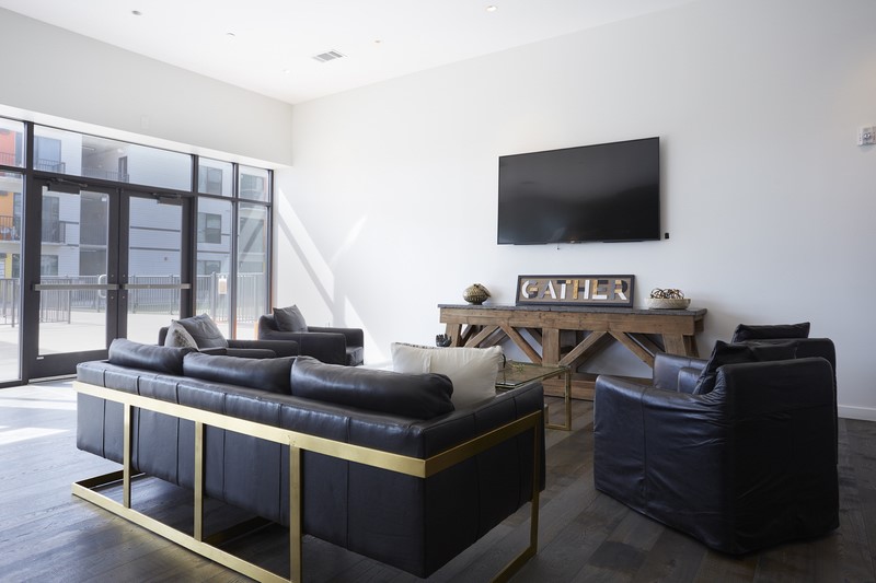 3550 Main Street, Unit 4415 Houston, TX 77002 - Photo 27 of 46 a living room with furniture and a flat screen tv