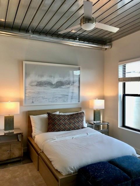 3550 Main Street, Unit 4415 Houston, TX 77002 - Photo 4 of 46 a bedroom with a bed and a mirror