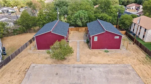 an aerial view of a house with outdoor space