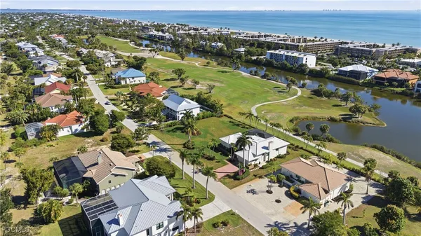 an aerial view of a house with a yard