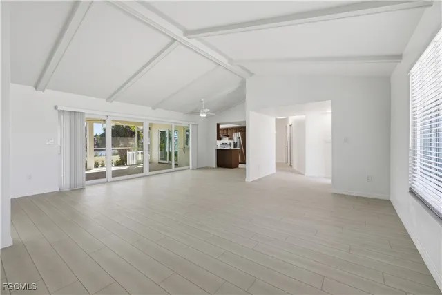 a view of a kitchen cabinets a sink and a window