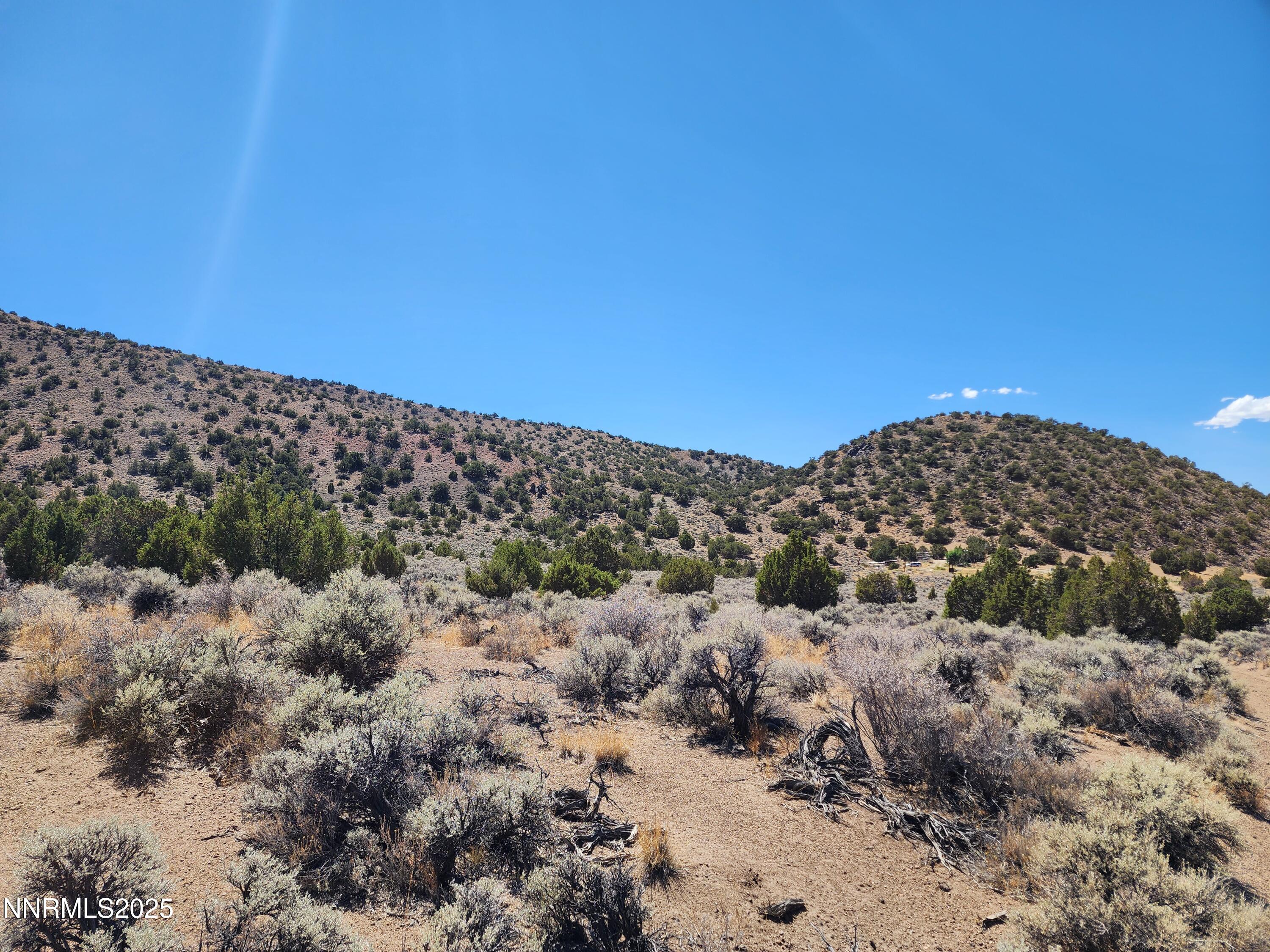 0 Right Hand Canyon Road, Unit 0RIGHT HAND CANYON RD Reno, NV 89510 - Photo 10 of 14 a view of a large building with a view of mountains in the background