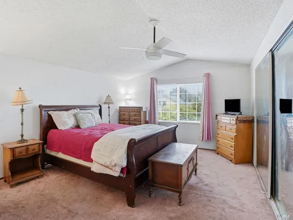 a bed room with a bed and a television