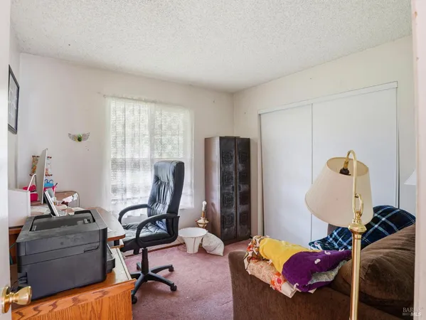a room with furniture and a window