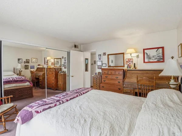 a bedroom with a bed and furniture