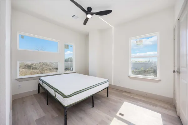 a living room with a bed and a window