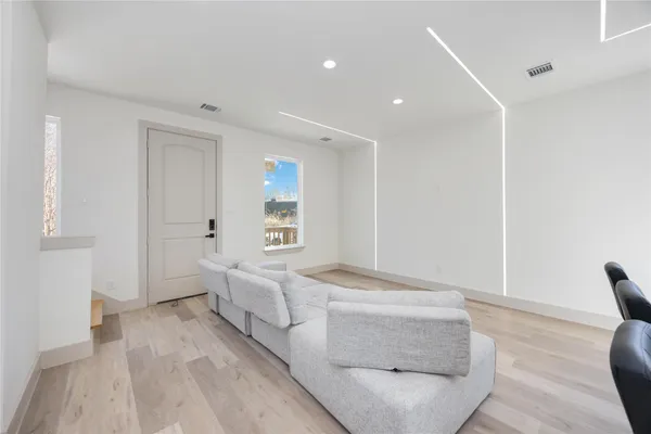 a living room with furniture and a table