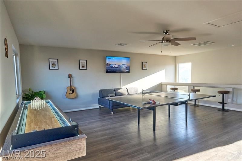 6302 Jackson Spring Road Las Vegas, NV 89118 - Photo 20 of 23 An inviting recreation space features wood flooring and ample room for entertainment.