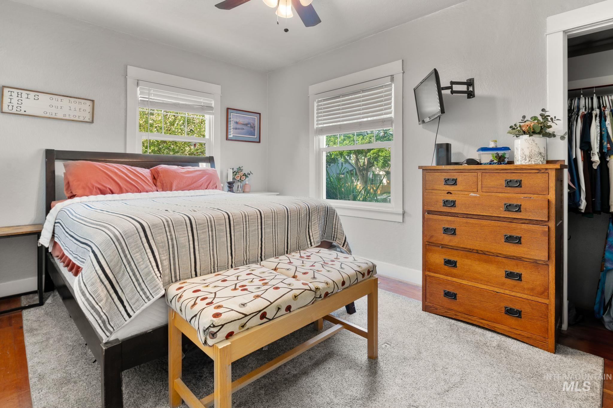 907 3rd Street Lewiston, ID 83501 - Photo 15 of 26 Bedroom featuring multiple windows, a ceiling fan, and light wood finished floors