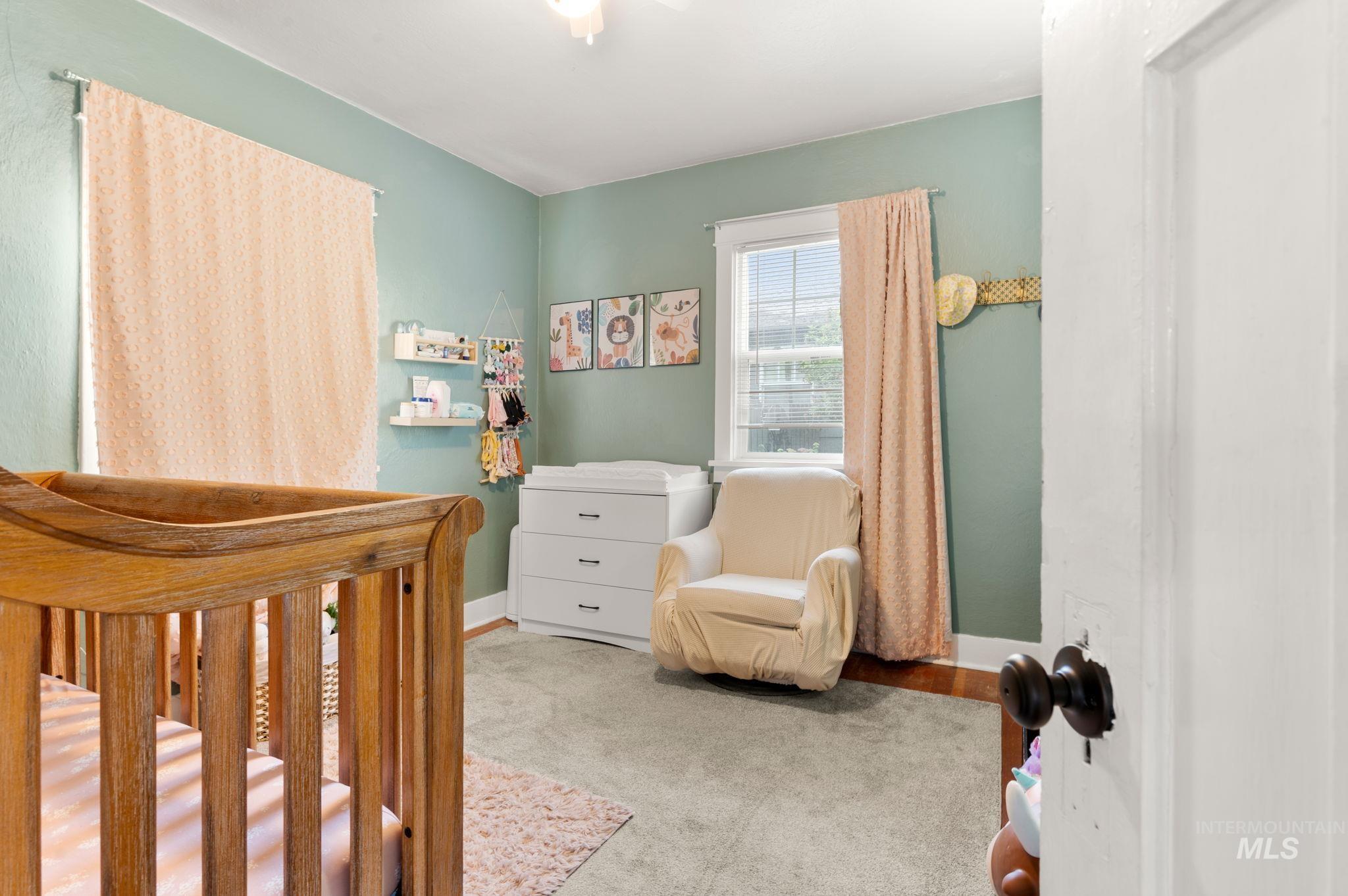 907 3rd Street Lewiston, ID 83501 - Photo 18 of 26 Bedroom with a nursery area and baseboards