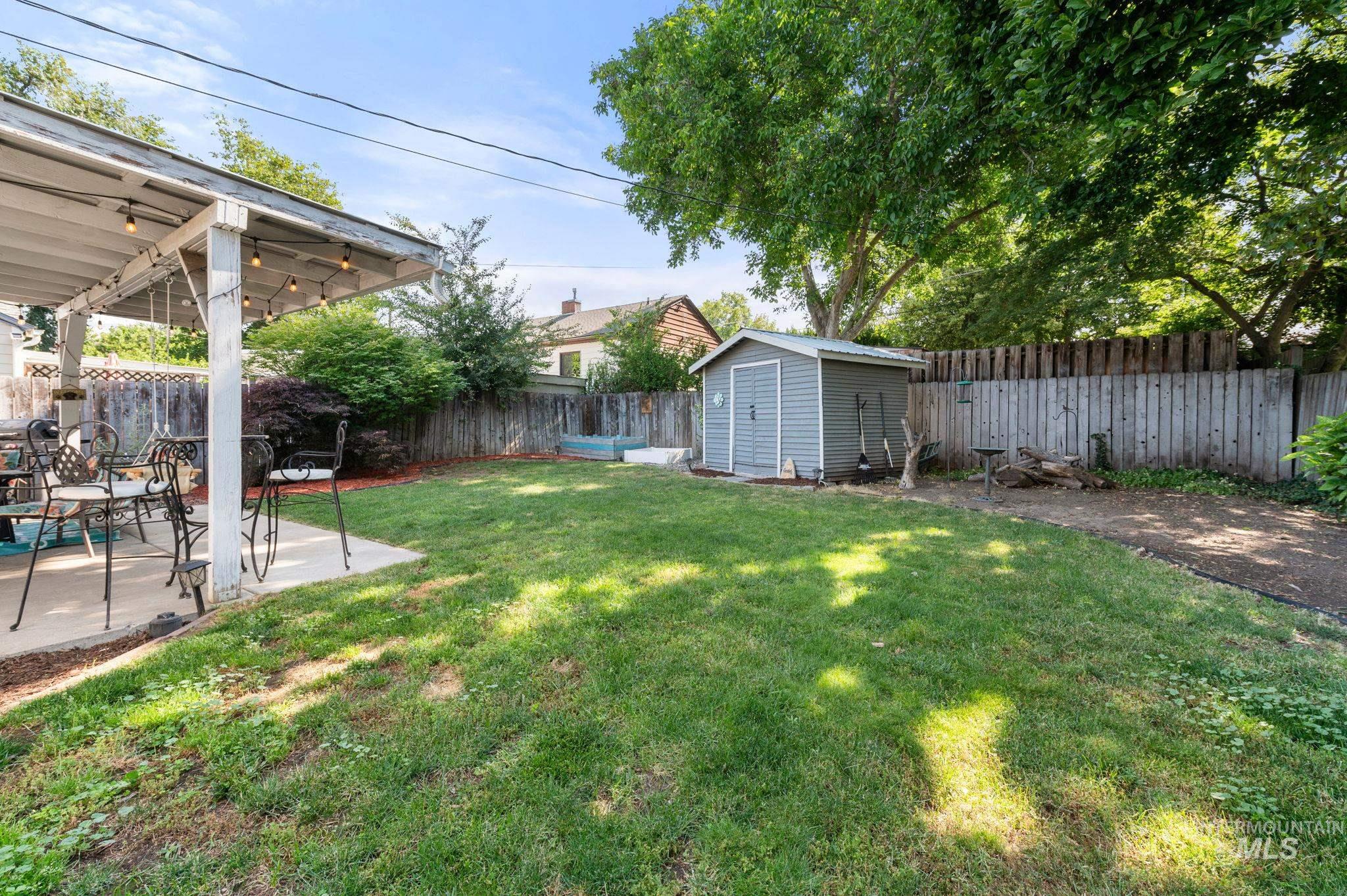 907 3rd Street Lewiston, ID 83501 - Photo 25 of 26 Fenced backyard featuring a patio area and a shed