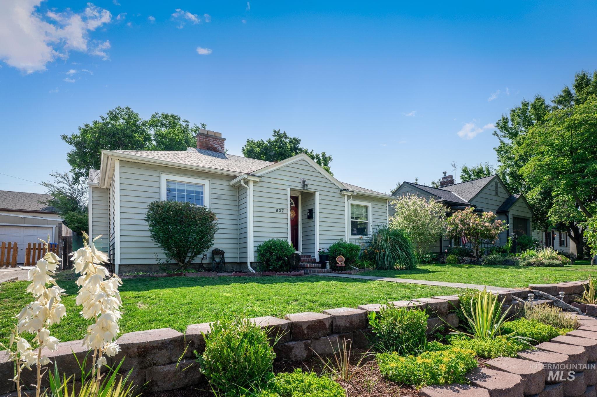 907 3rd Street Lewiston, ID 83501 - Photo 3 of 26 View of front of home with a front lawn and a chimney