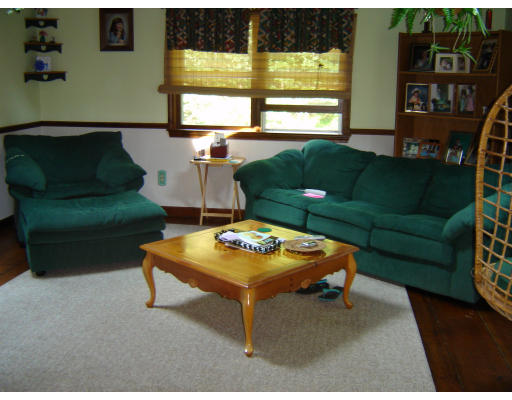 37 Squannacook Road Shirley, MA 01464 - Photo 8 of 8 a living room with furniture and a floor to ceiling window