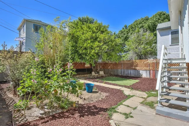 a backyard of a house with lots of green space