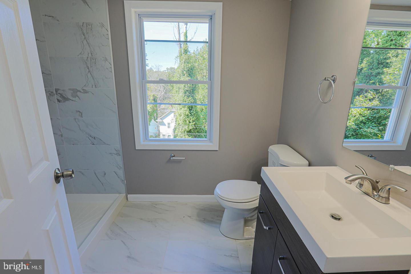 1904 Cedric Road Baltimore, MD 21216 - Photo 12 of 16 a bathroom with a sink toilet and tub
