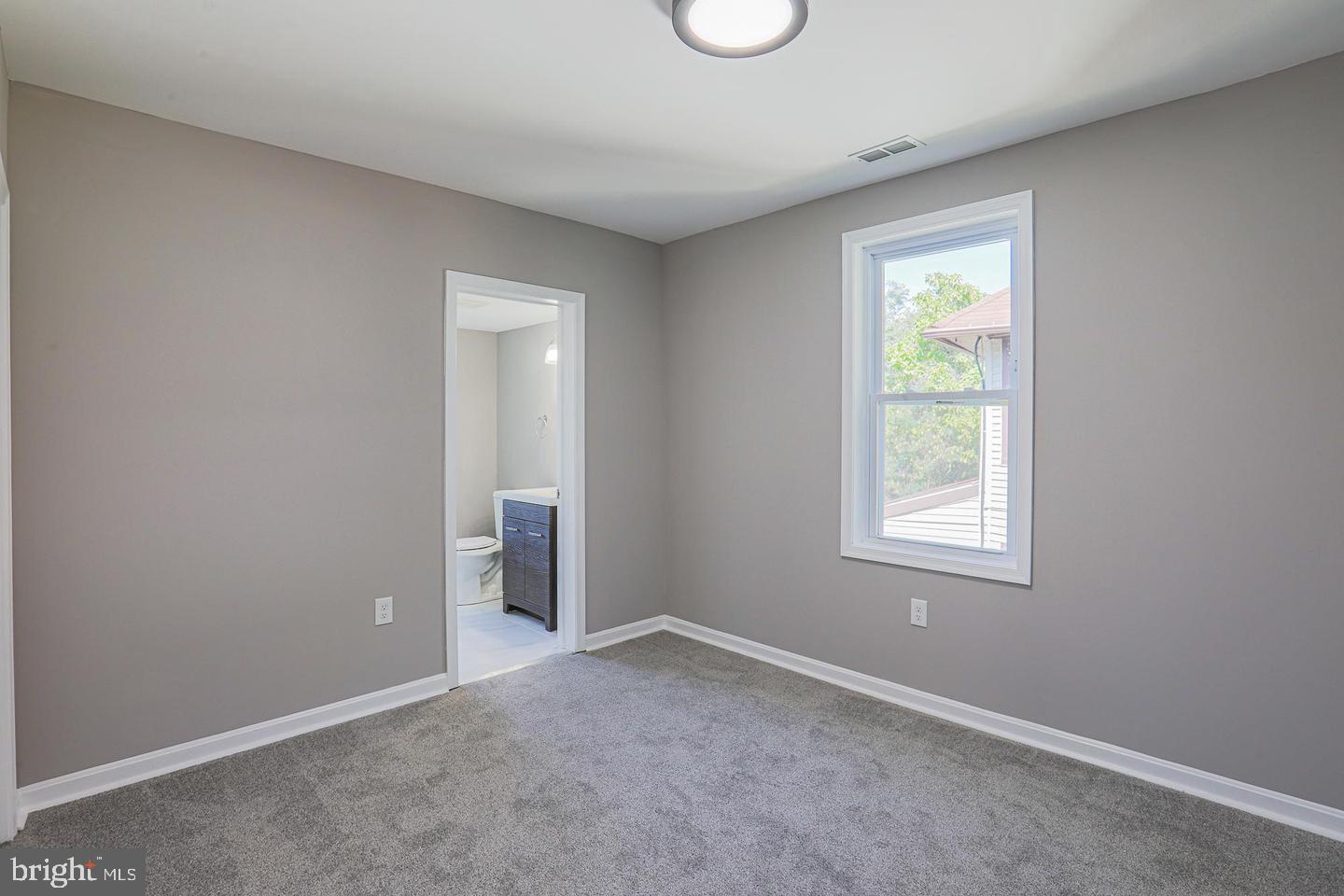 1904 Cedric Road Baltimore, MD 21216 - Photo 13 of 16 an empty room with windows