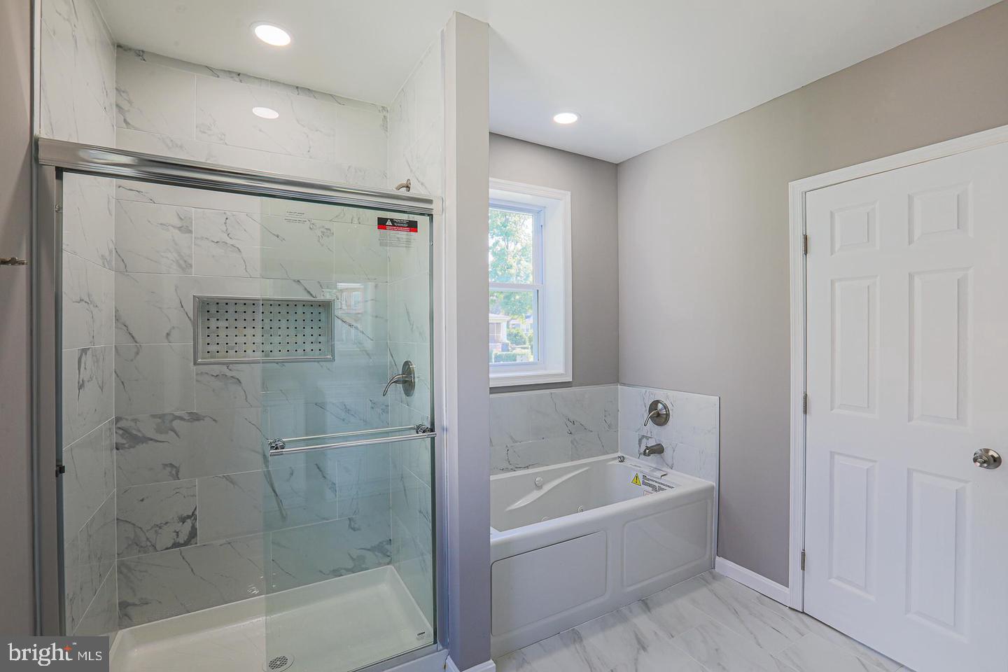 1904 Cedric Road Baltimore, MD 21216 - Photo 2 of 16 a bathroom with a bathtub and a shower