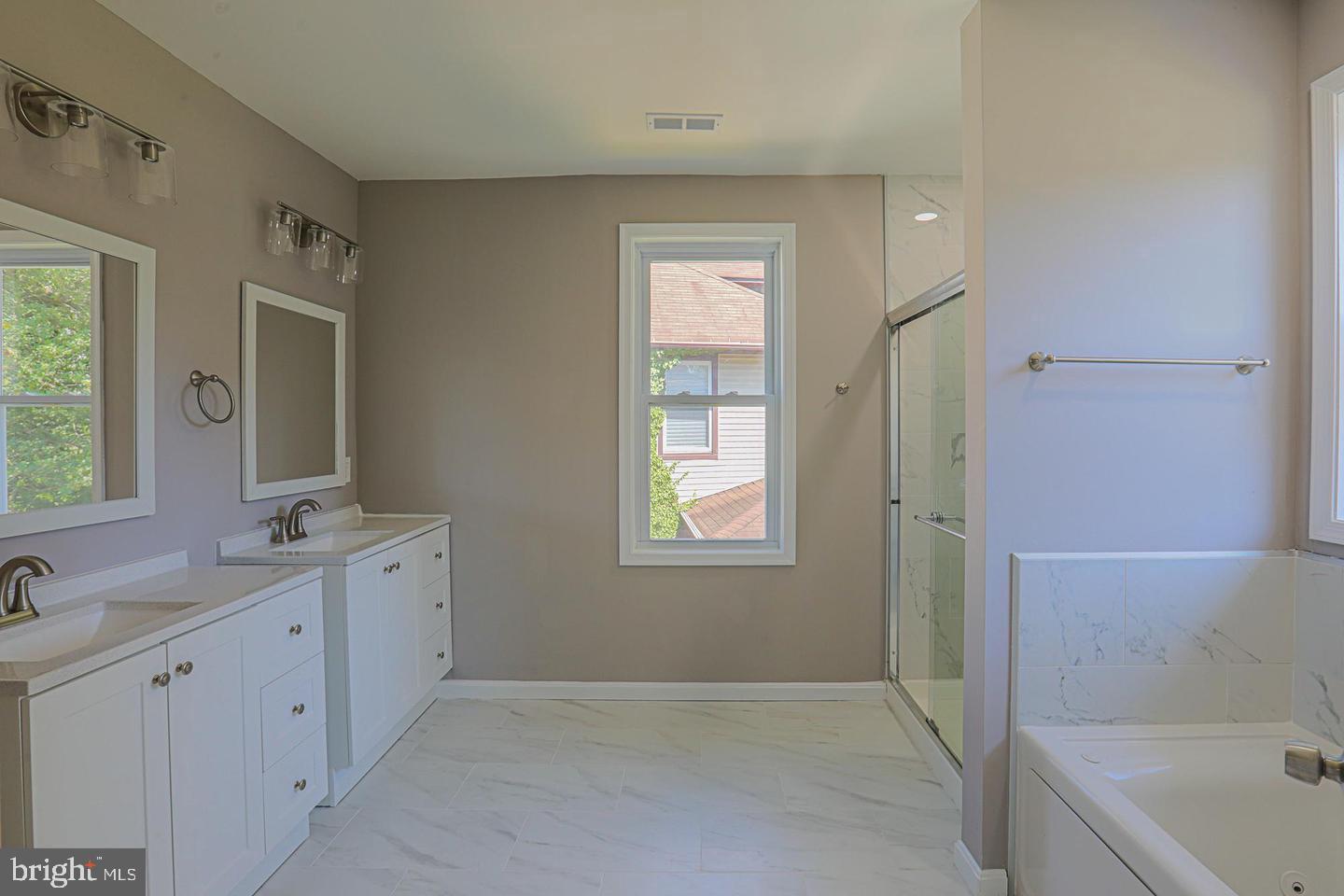 1904 Cedric Road Baltimore, MD 21216 - Photo 3 of 16 a bathroom with a tub sink and mirror