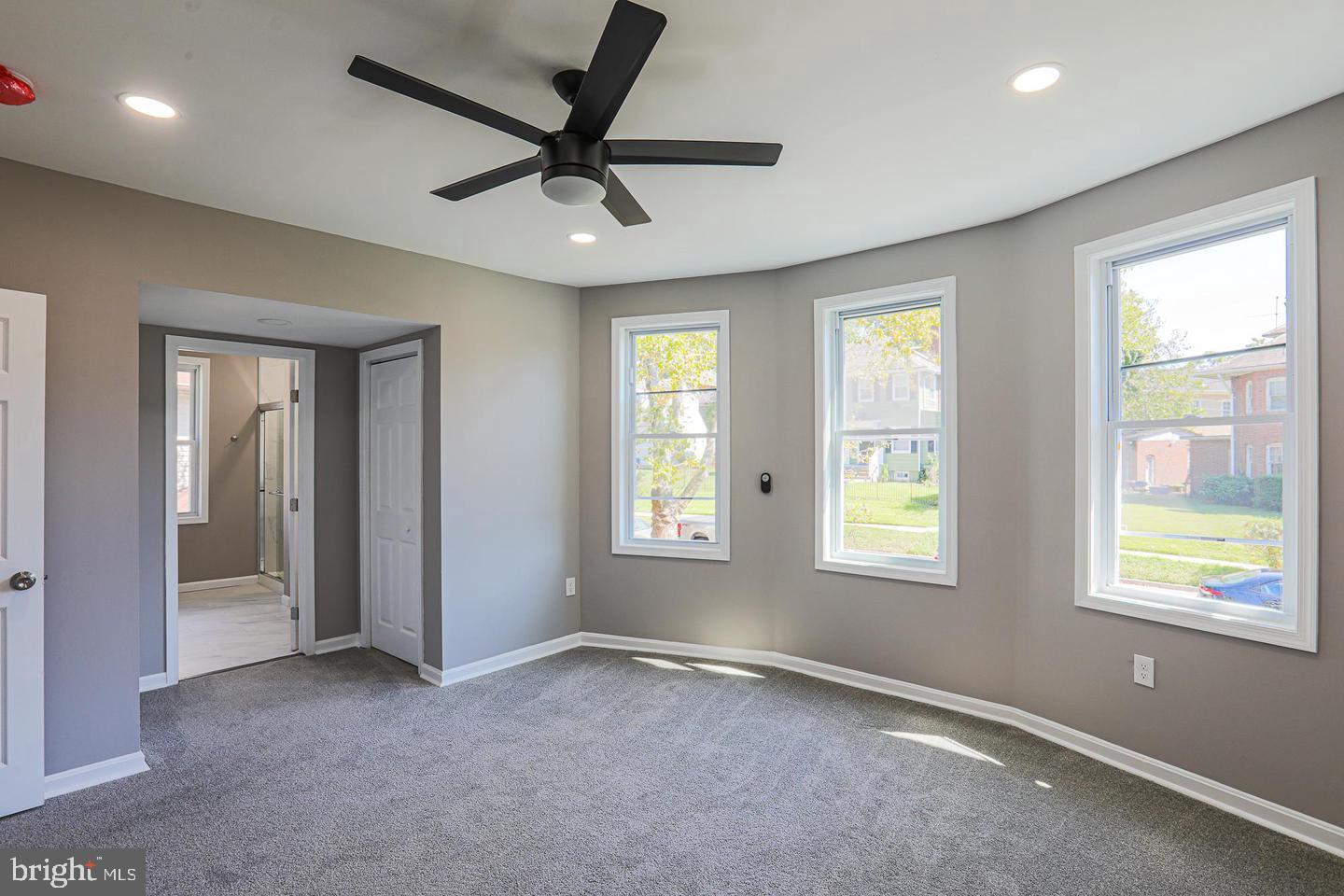 1904 Cedric Road Baltimore, MD 21216 - Photo 4 of 16 a view of a livingroom with a ceiling fan and window