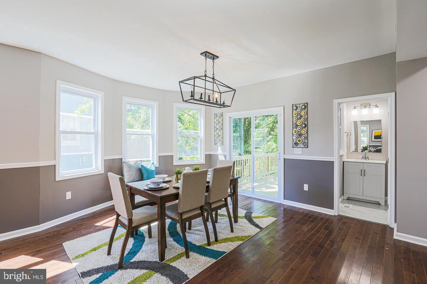 1904 Cedric Road Baltimore, MD 21216 - Photo 7 of 16 a view of a dining room with furniture window and wooden floor