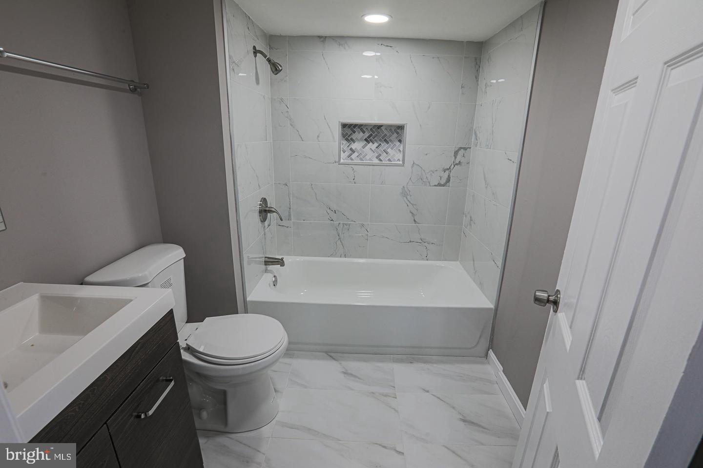 1904 Cedric Road Baltimore, MD 21216 - Photo 9 of 16 a bathroom with a toilet and a bath tub