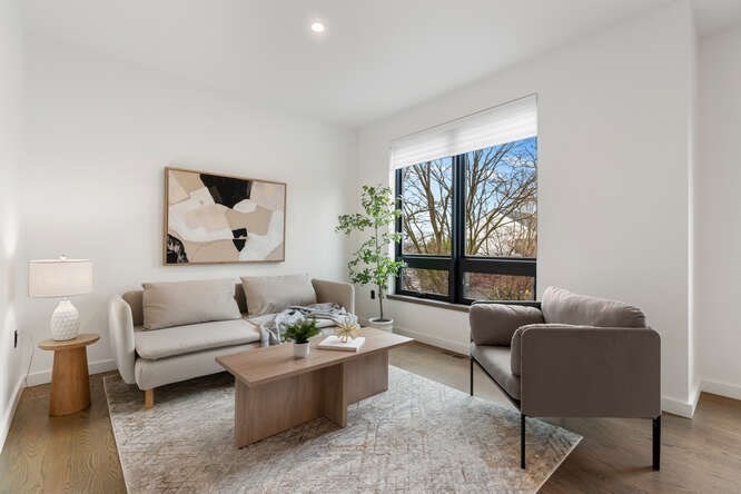 46 Beverly Road Arlington, MA 02474 - Photo 15 of 42 a living room with furniture and a large window