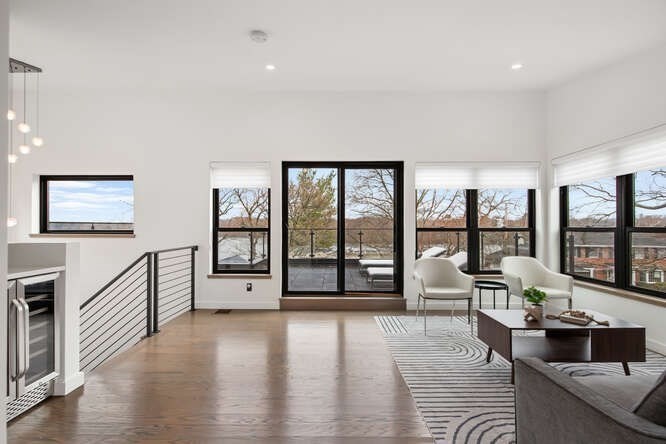 46 Beverly Road Arlington, MA 02474 - Photo 29 of 42 a living room with furniture large window and wooden floor