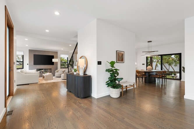 46 Beverly Road Arlington, MA 02474 - Photo 6 of 42 a living room with furniture potted plant floor to ceiling window and flat screen tv