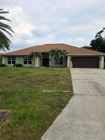 a view of house with yard