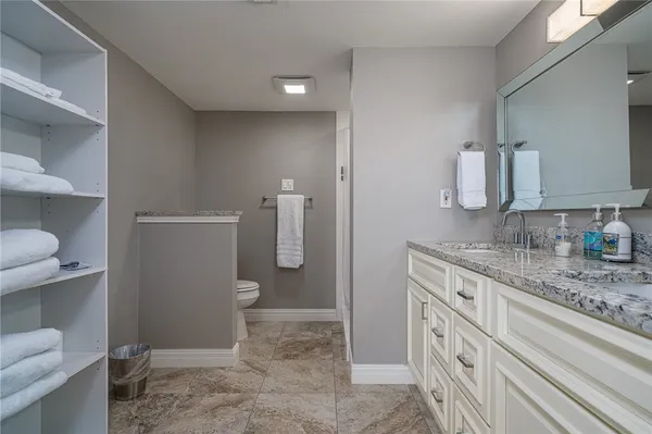 a bathroom with a shower and a sink