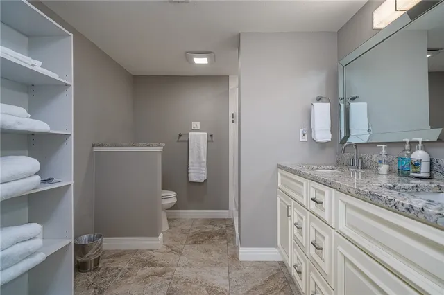 a bathroom with a shower and a sink